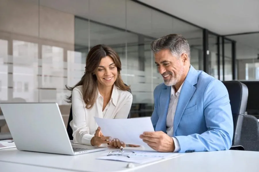 Financial advisor consulting with a client in a modern office